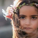young girl wearing headress of flowers