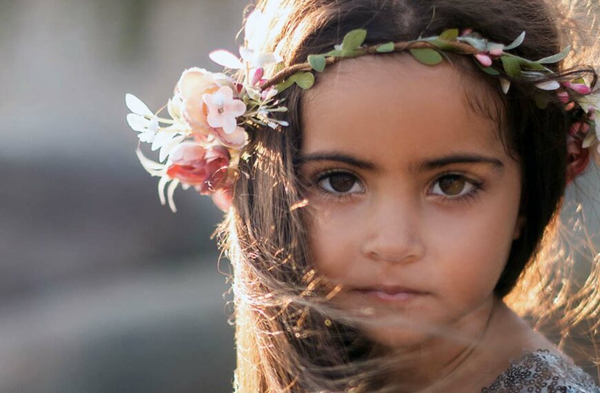 young girl wearing headress of flowers