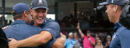 Bryson Dechambeau congratulated by team mates