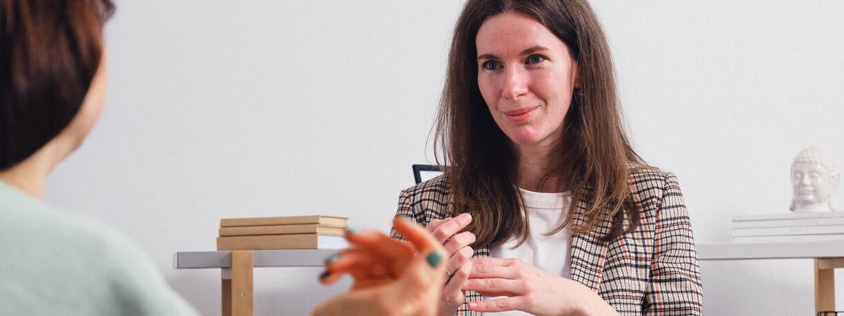 Person speaks to someone about therapy