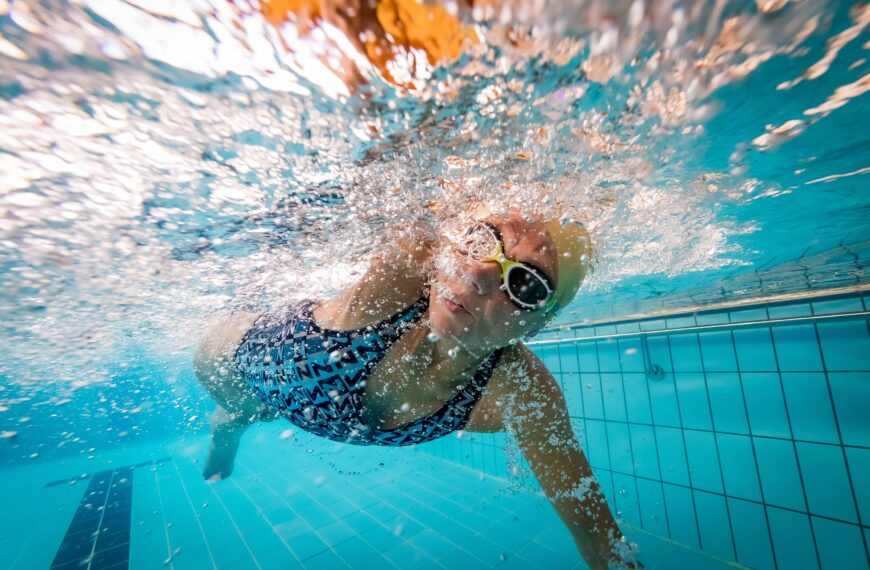 Underwater shot of woman swimming front crawl