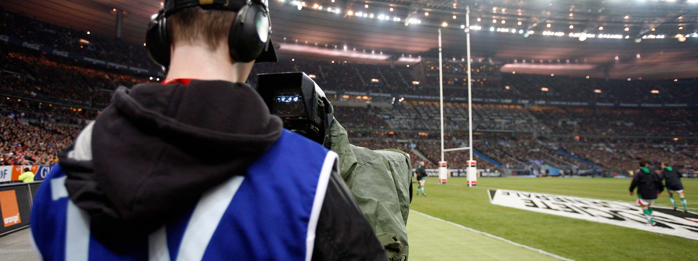 Cameraman at a rugby match