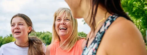 women share a joke whilst getting fit