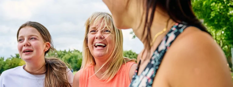 women share a joke whilst getting fit