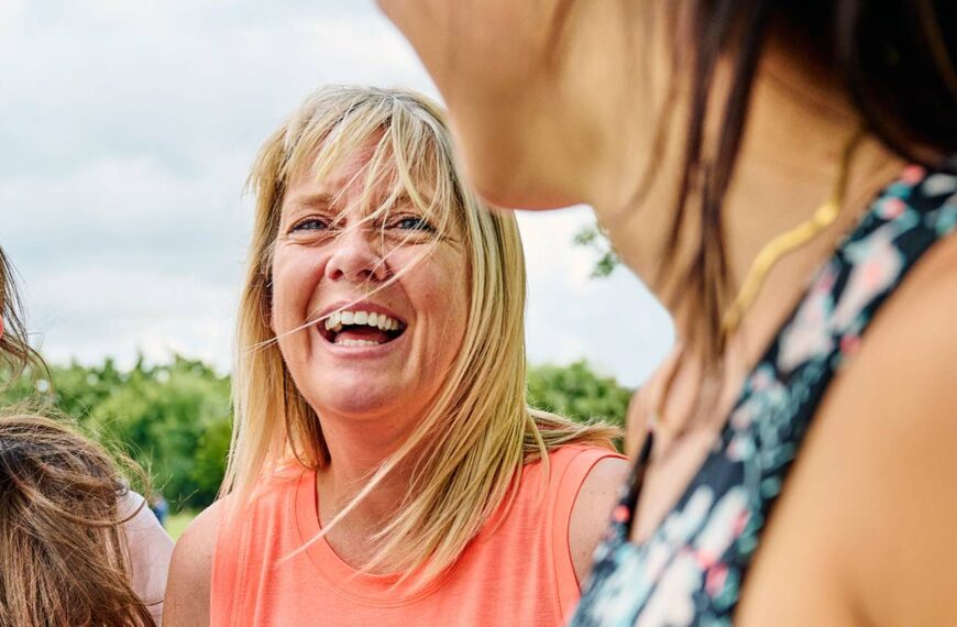 women share a joke whilst getting fit