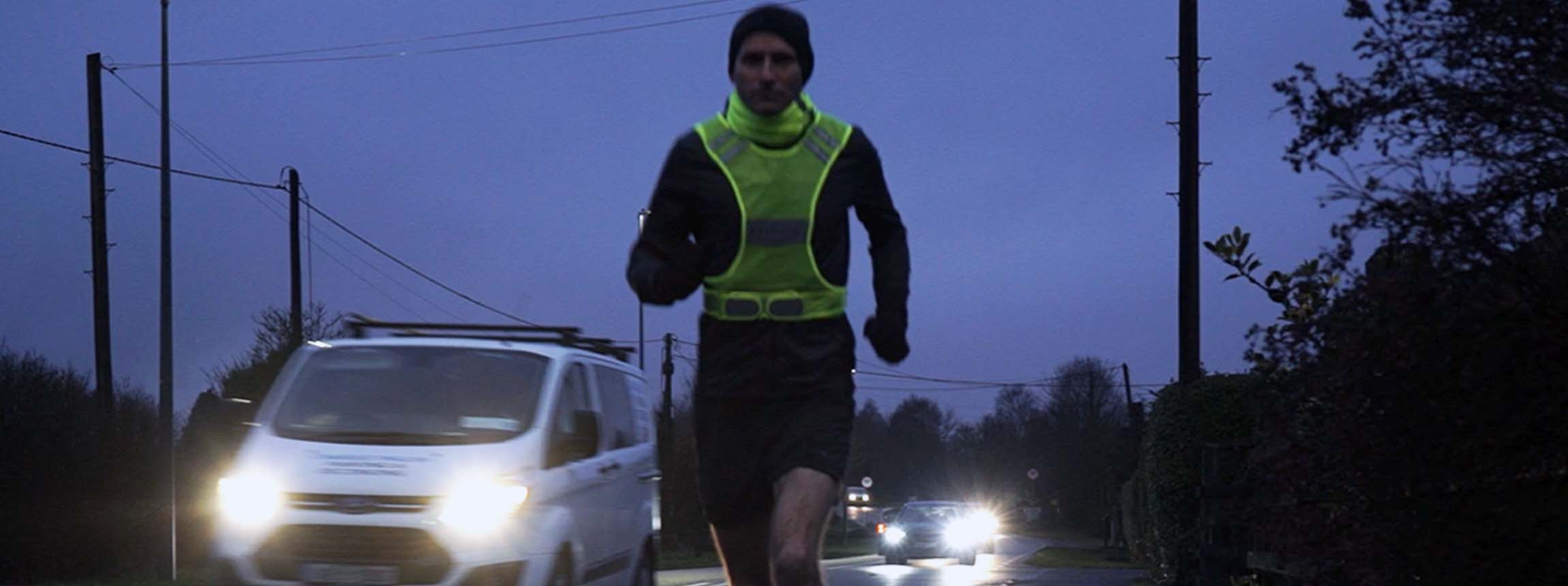 Runner wearing bodylite reflective vest