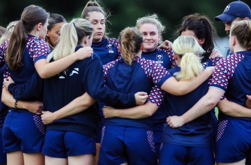 Bristol Sports Team in group huddle