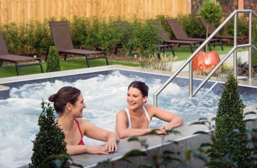 women enjoy talking in swimming pool