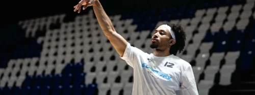 Basketball player throws ball