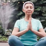 Senior woman sits in yoga position
