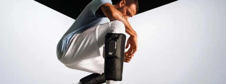 person wearing hyperice normatec boots