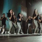 Young group of people dance on stage