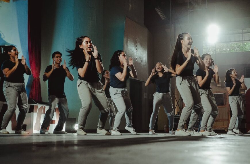 Young group of people dance on stage