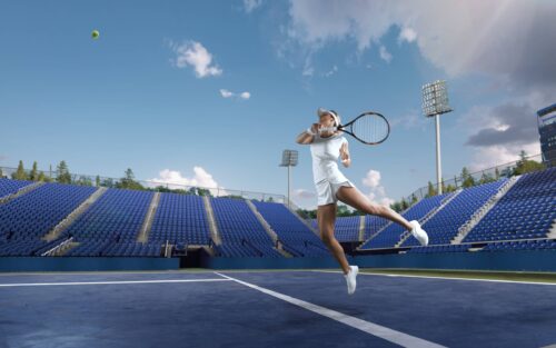 female tennis player serving outdoor on professional tennis court.