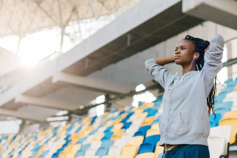 teenager watching the match on the stadium
