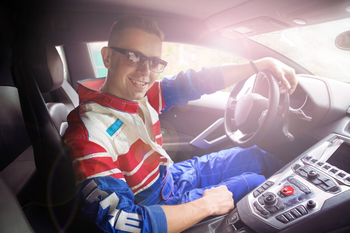 young man in sports car