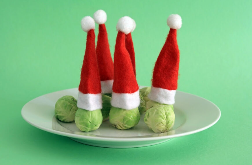 Brussel Sprouts Wearing Christmas Festive Hats. Christmas Vegetables Concept.