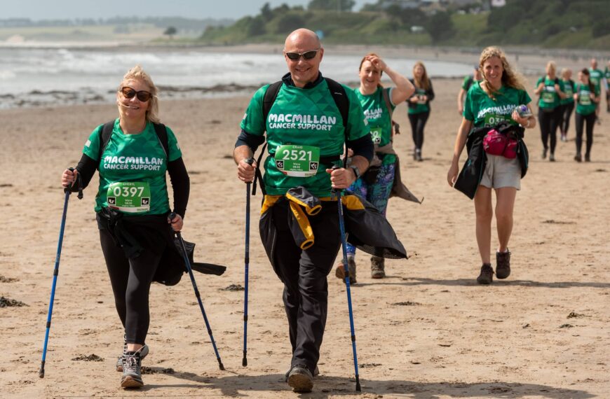 Macmillan Mighty Hikers walk across beach