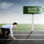 Male entrepreneur ready run near a signpost