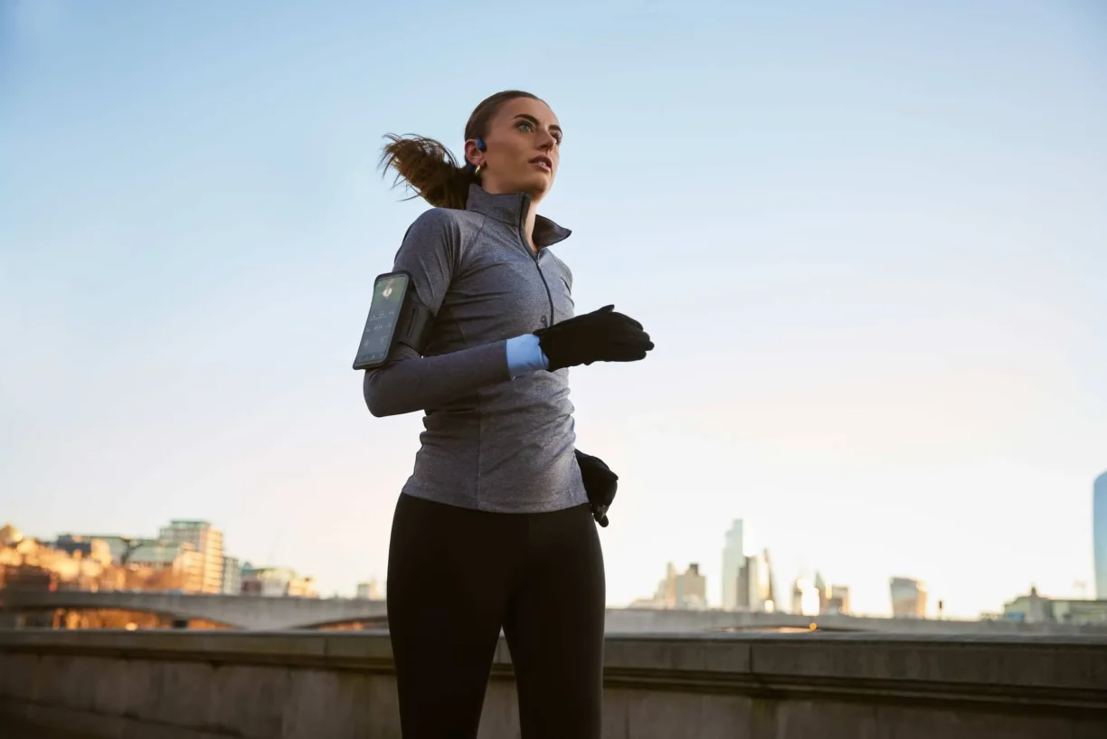 Woman runs listening to music