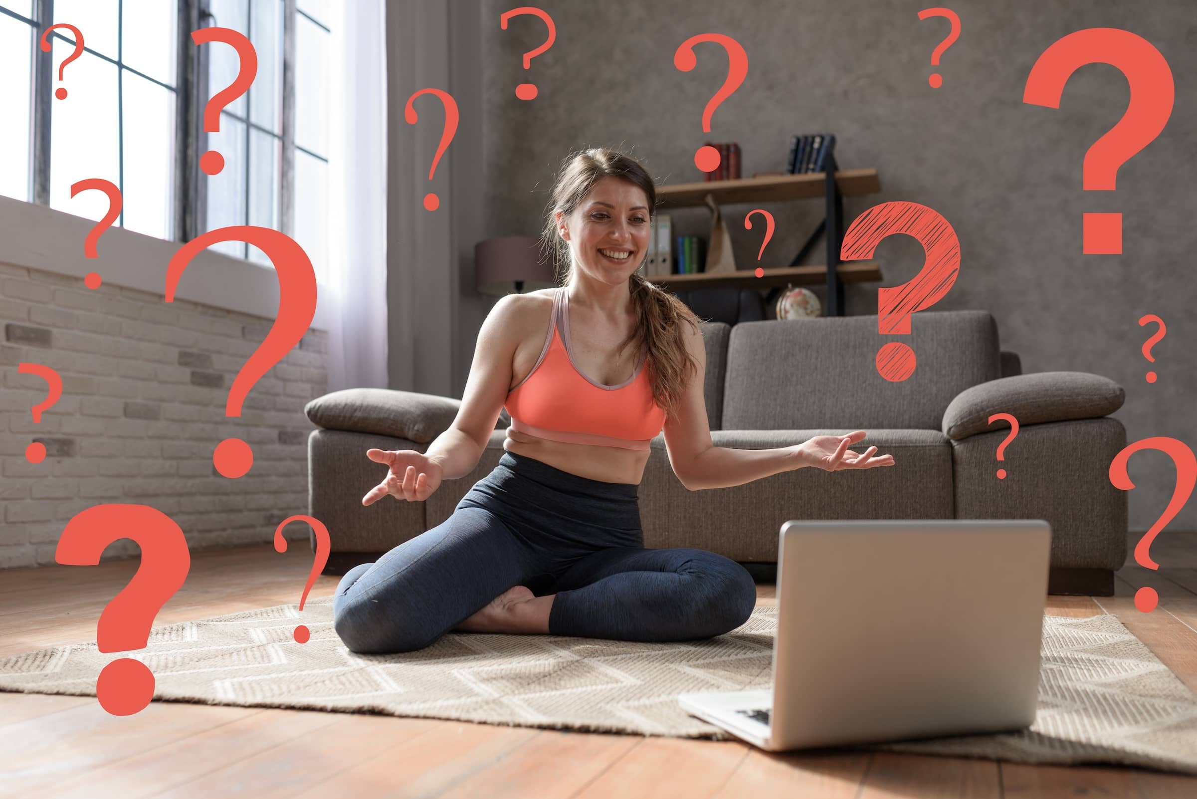 Young woman follows gym exercises with a laptop