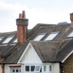 A row of British houses with roof windows