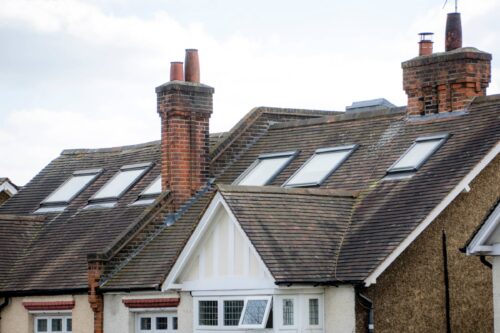 A row of British houses with roof windows