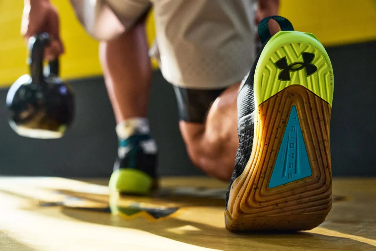 Fitness Person Wearing Under Armour activewear exercises with kettlebell