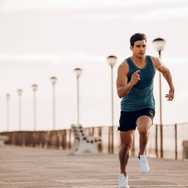 Male-runner-sprinting-outdoors-in-morning
