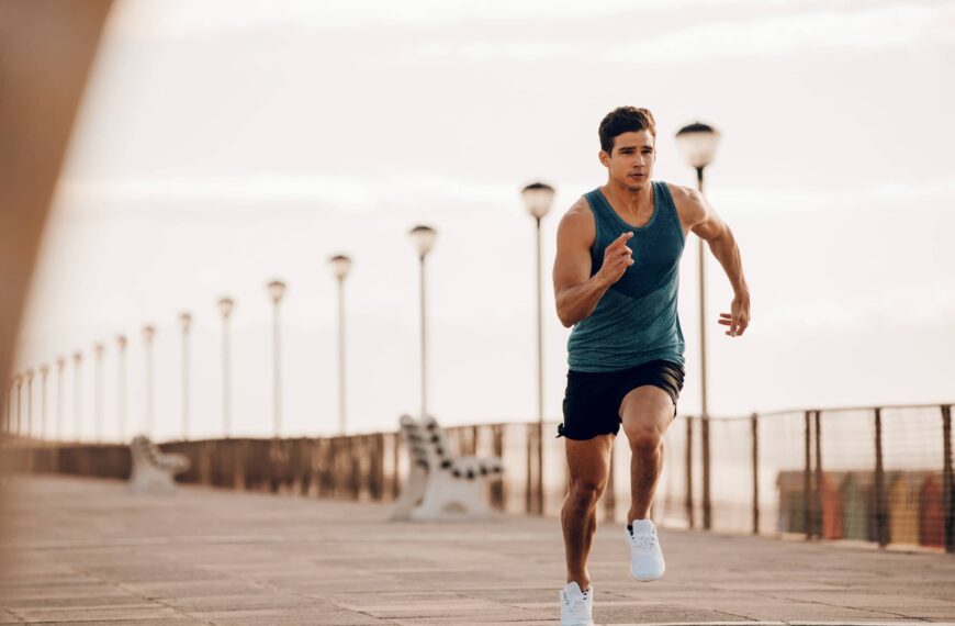 Male-runner-sprinting-outdoors-in-morning