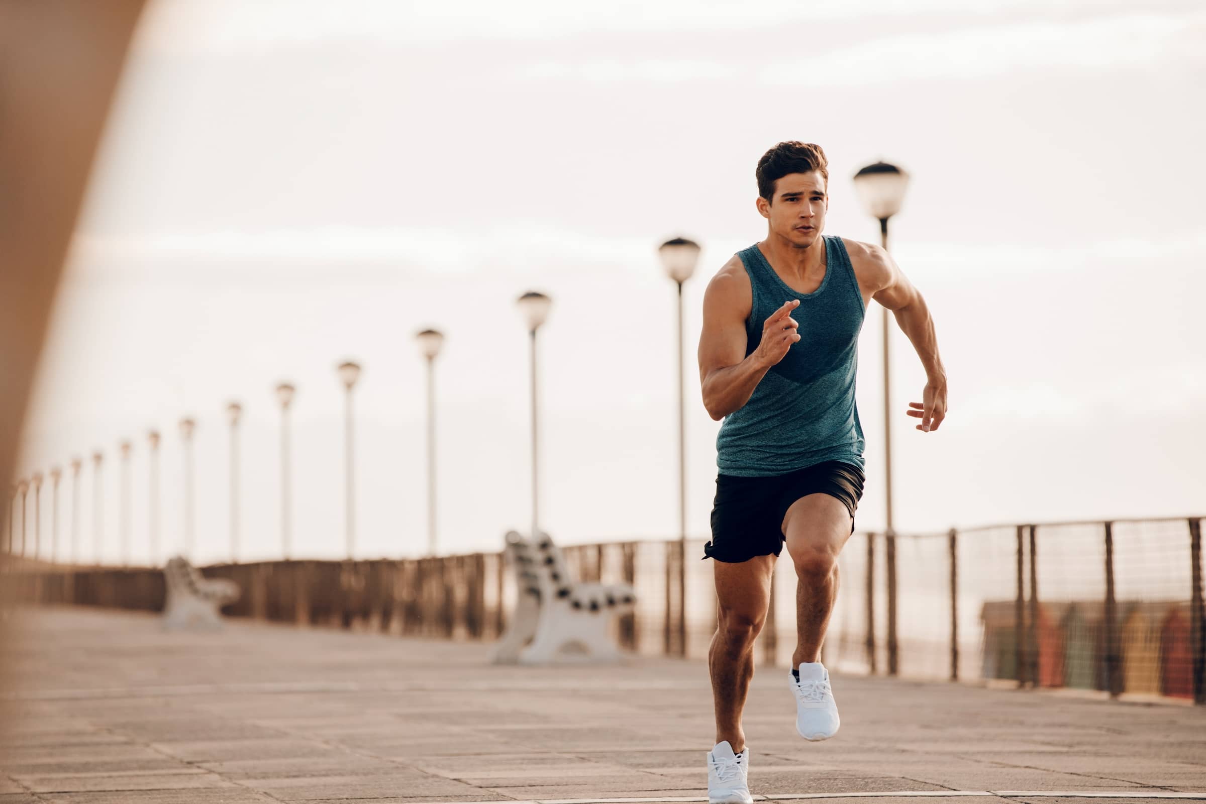 Male-runner-sprinting-outdoors-in-morning