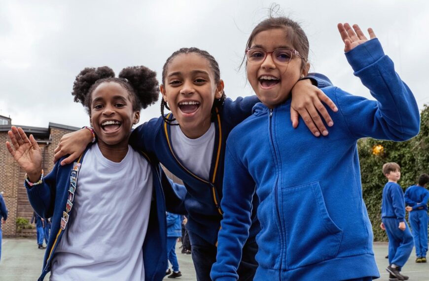 children smiling in playground