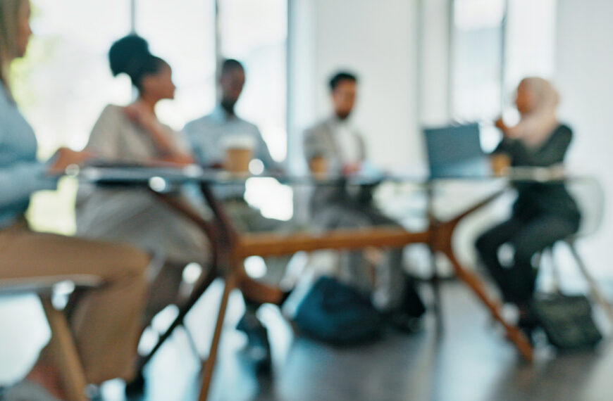 Blurry, corporate and staff brainstorming, innovation and set deadlines in meeting, partnership and sales growth. Blur, team and employees share ideas, confirm budget and collaboration in workplace