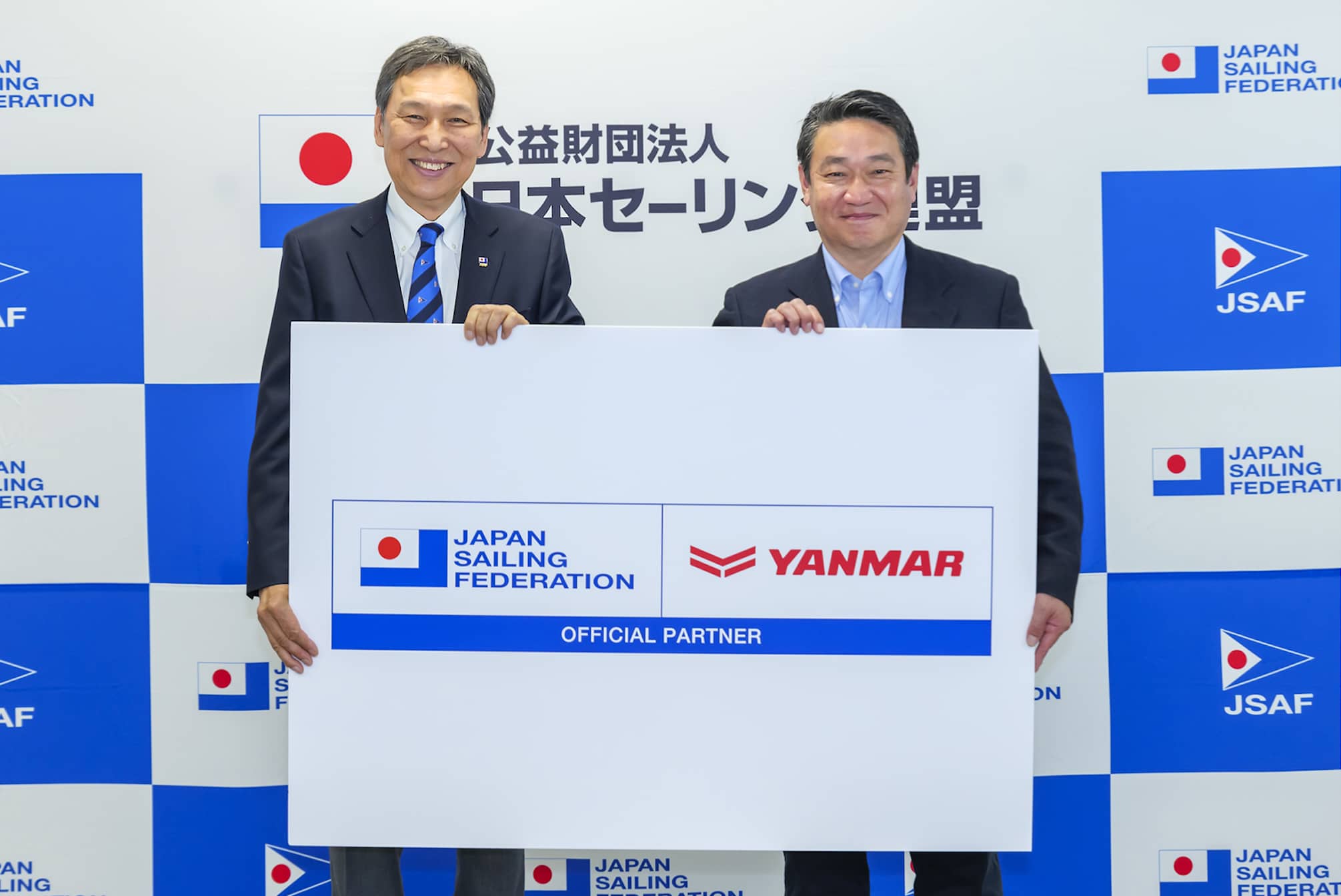 Masuhiro Banba, President of the Japan Sailing Federation, and Tsutomu Murayama, Head of the Sports Business Office at Yanmar Holdings Co., Ltd.