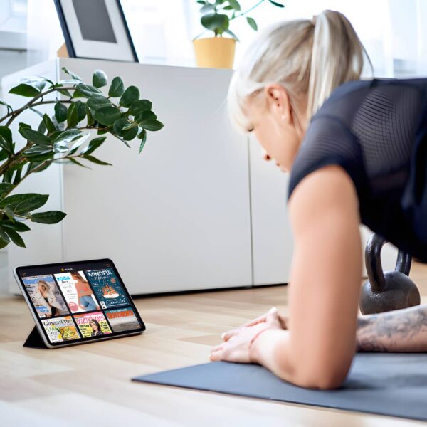 woman on tablet holding plank position