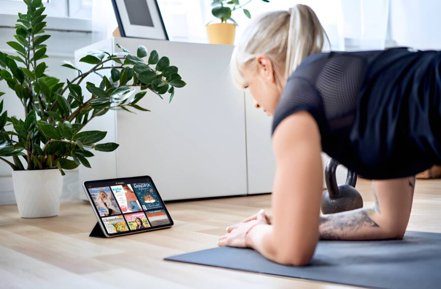 woman on tablet holding plank position