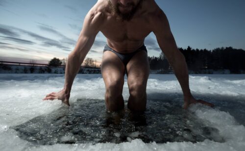 Person climbs into Ice hole