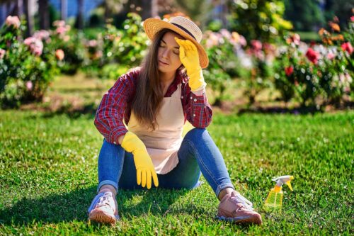 gardener sits on grass