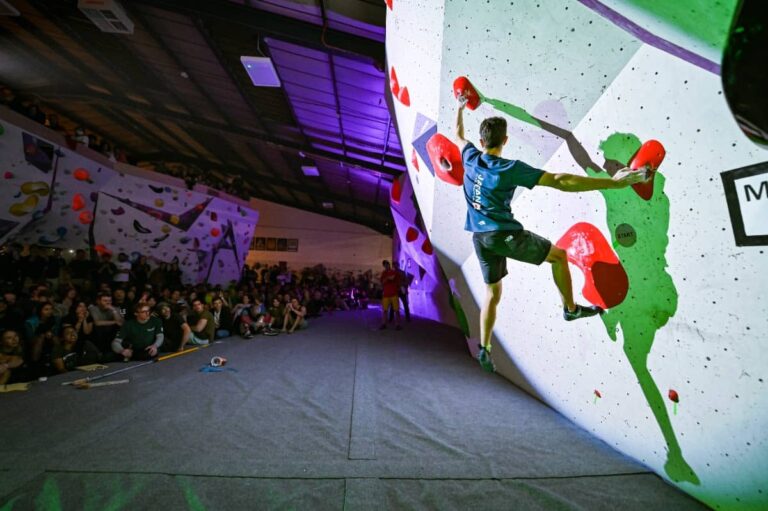 Person-climbs-an-indoor-climbing-wall