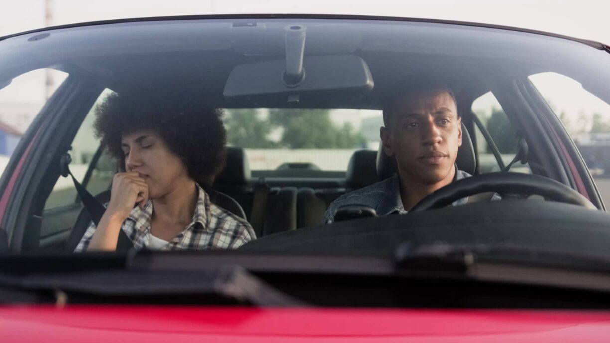 Couple look upset in a car together