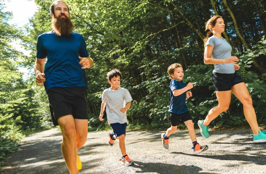 Family exercising and jogging together at an outdoor park