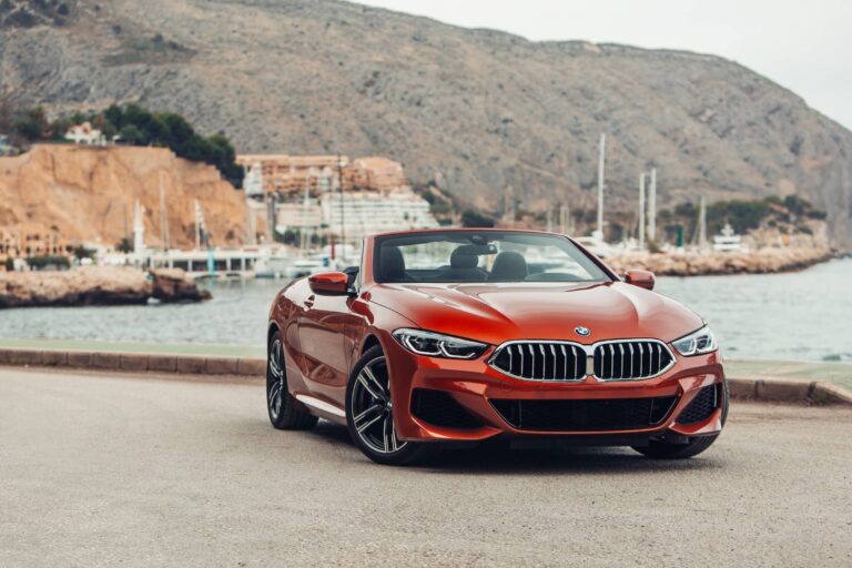 BMW 8 series G14 convertible at the parking of a sea shore