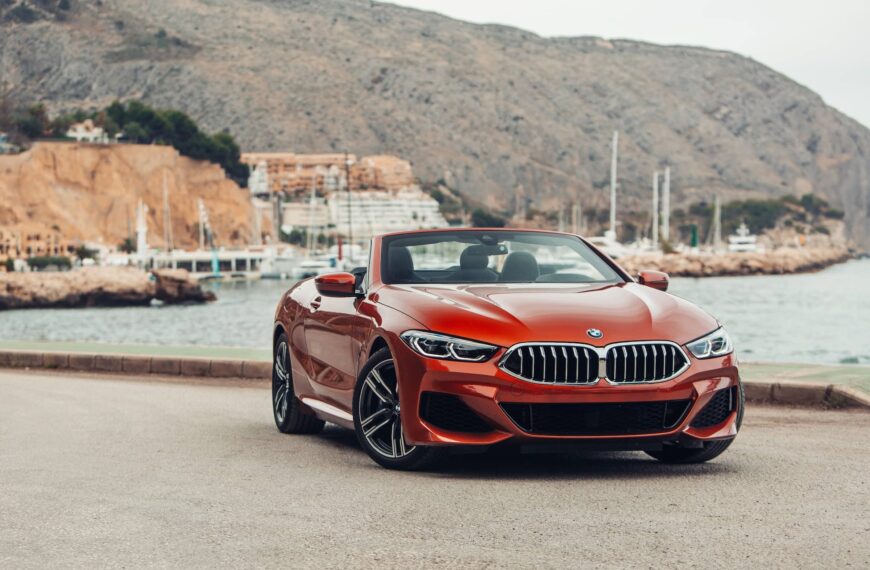 BMW 8 series G14 convertible at the parking of a sea shore