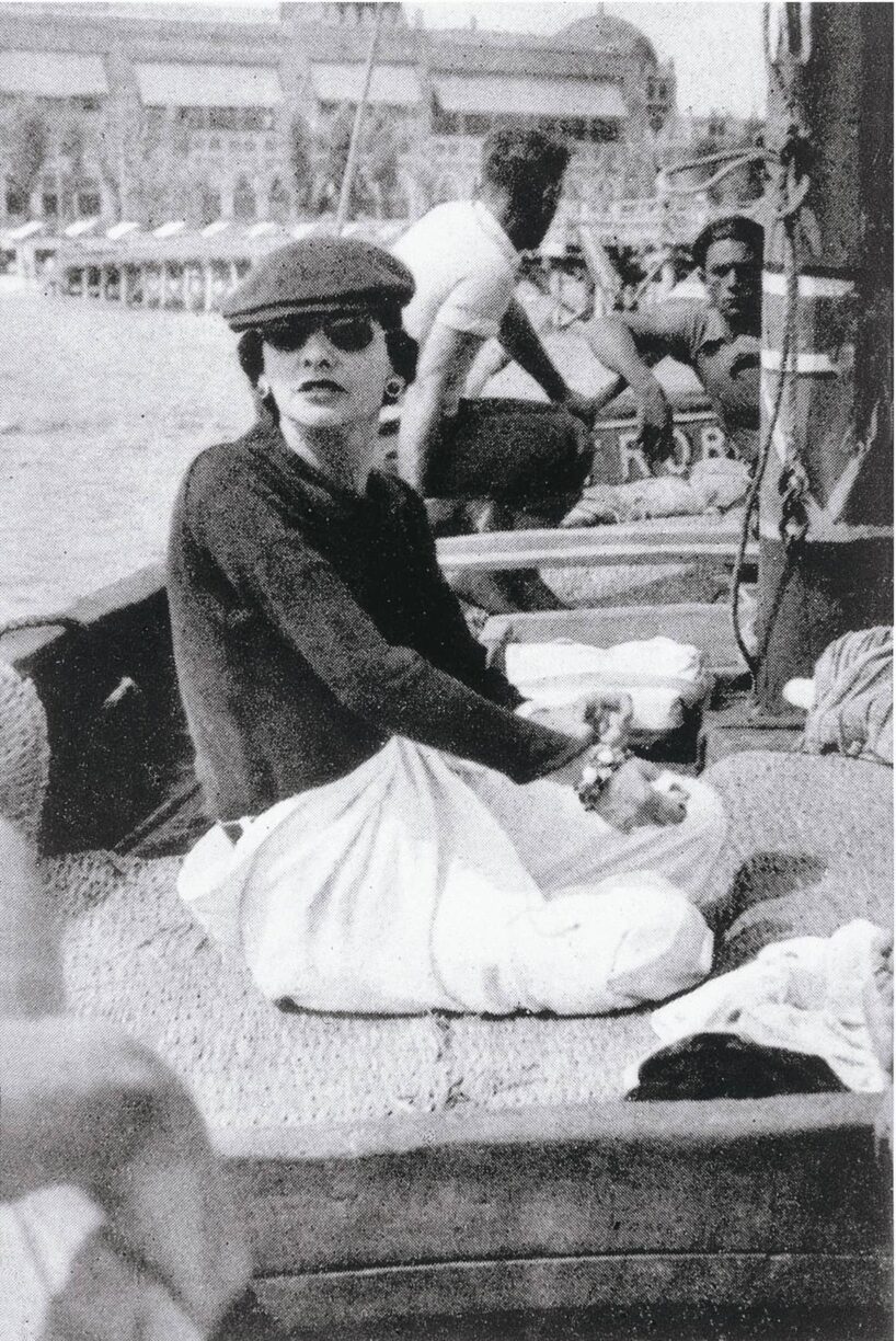 Gabrielle Chanel on Roussy Sert's yacht in front of the Lido, Venice, 1936. © V.H. Grandpierre:Vogue Paris