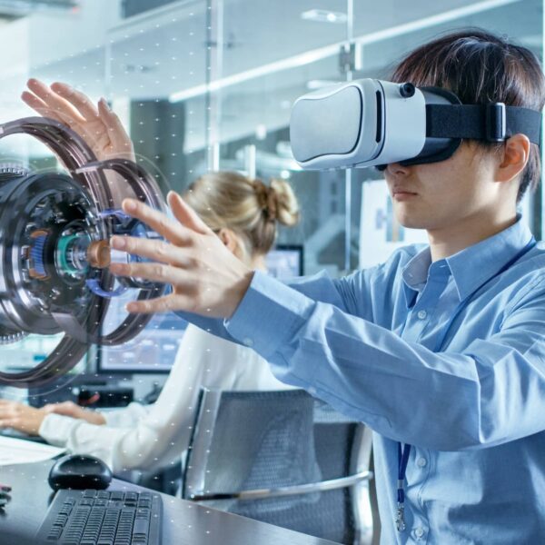 Computer Science Engineer wearing Virtual Reality Headset Works with 3D Model Hologram Visualisation