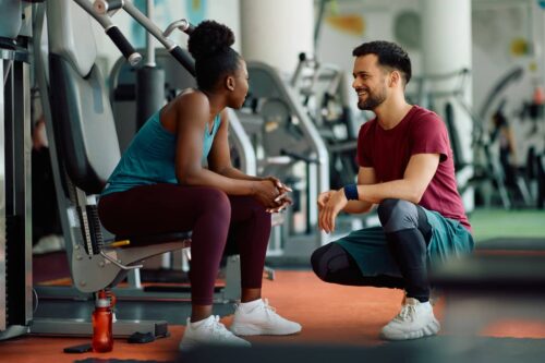 Couple talk in gym