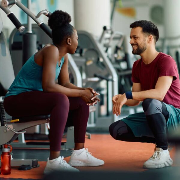 Couple talk in gym