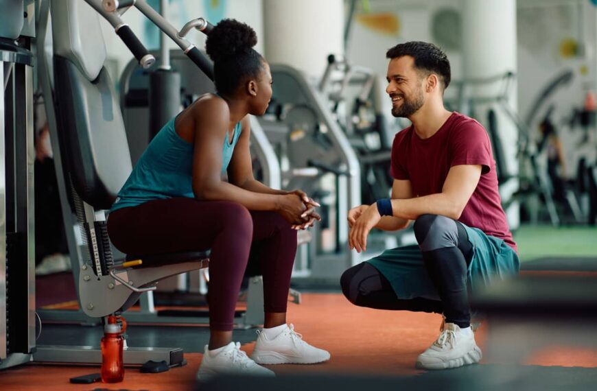 Couple talk in gym