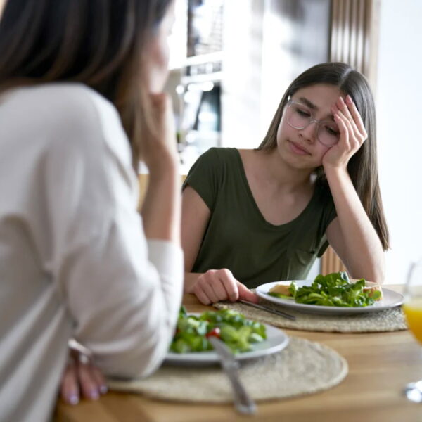 Woman looks upset over dinner