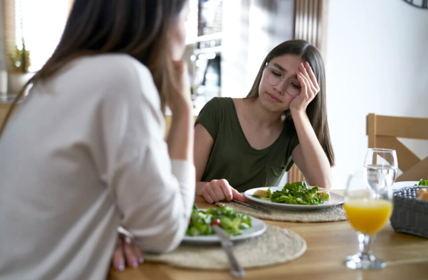 Woman looks upset over dinner